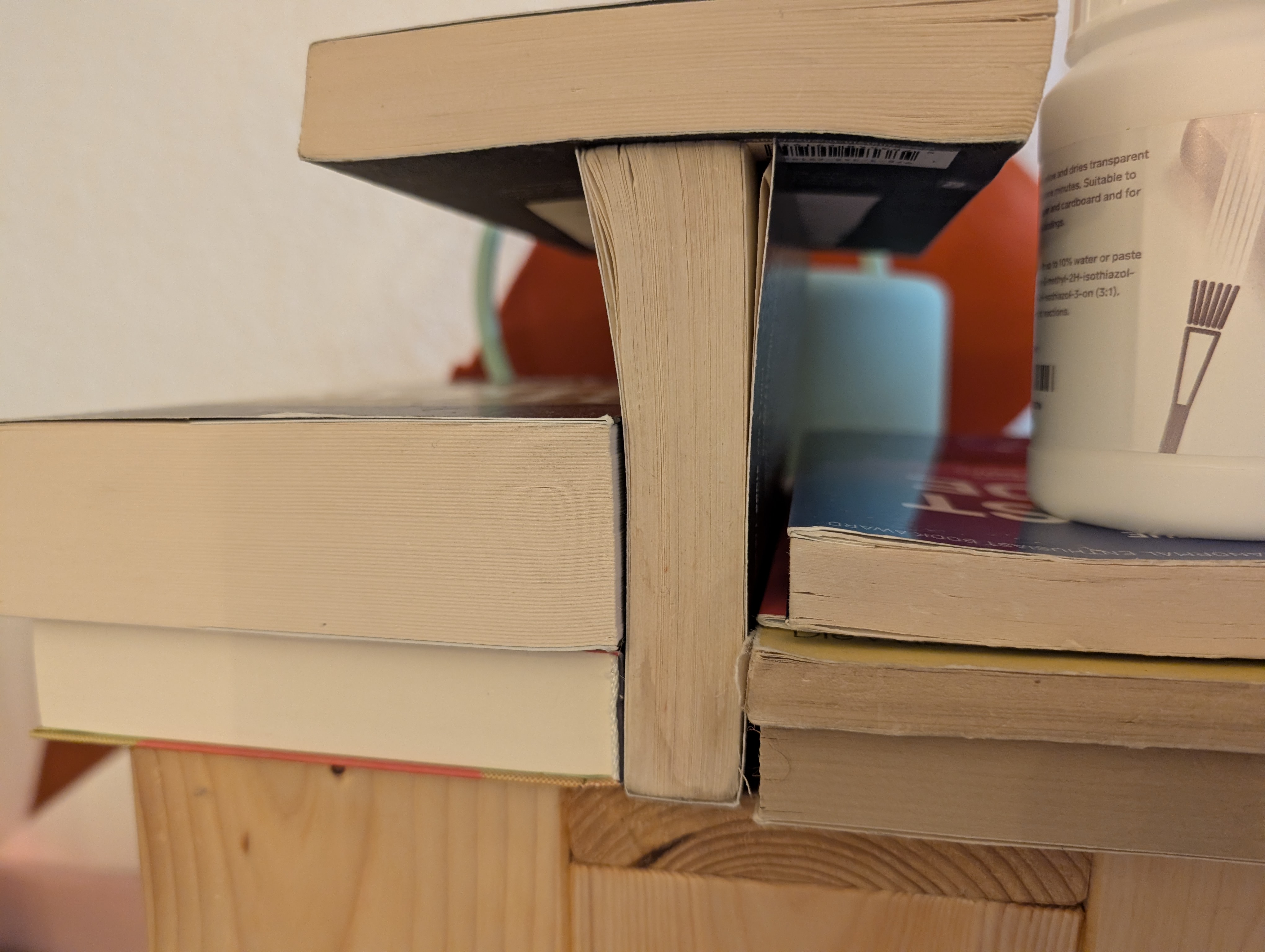 The book with its newly glued-on cover, resting on its spine