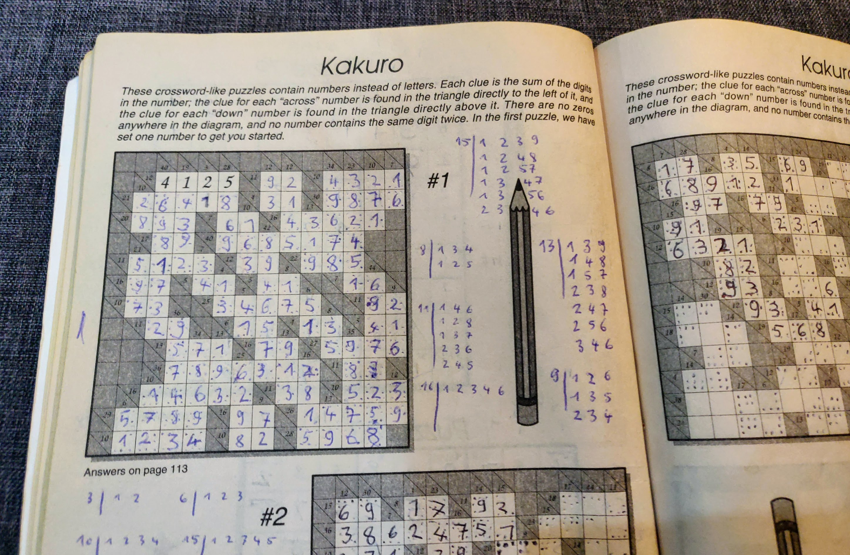 Photo of a page of Kakuros of a Sudoku book on a couch in a flat in Lisbon