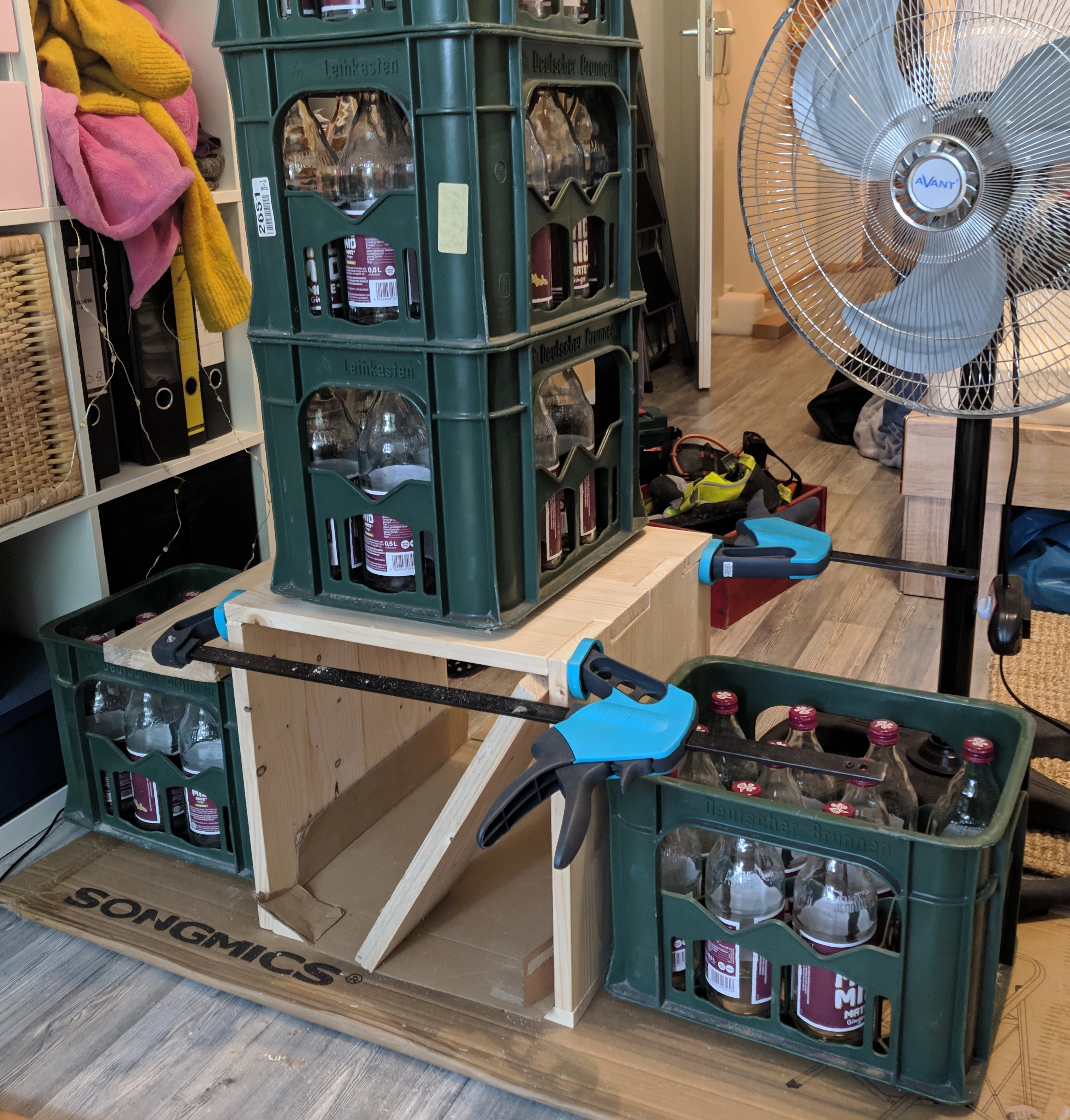 Box surrounded by Mate crates